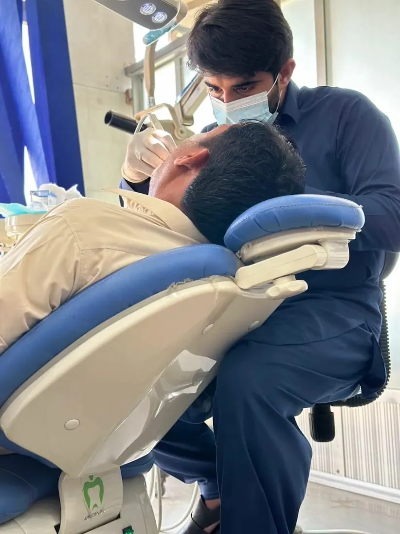 Dr. Faizan Ali Shahid providing gentle patient dental care